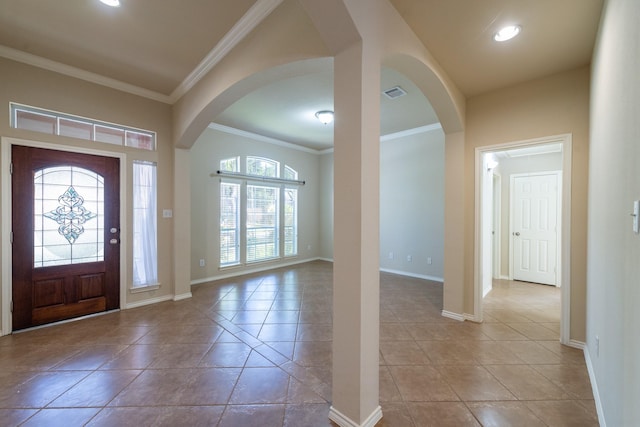 foyer entrance featuring ornamental molding and light tile patterned floors