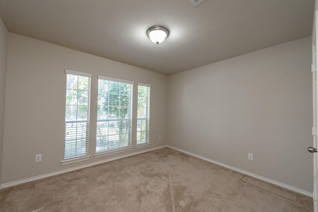 empty room with light colored carpet