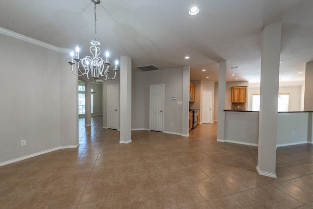 interior space featuring a notable chandelier, ornamental molding, and light tile patterned floors