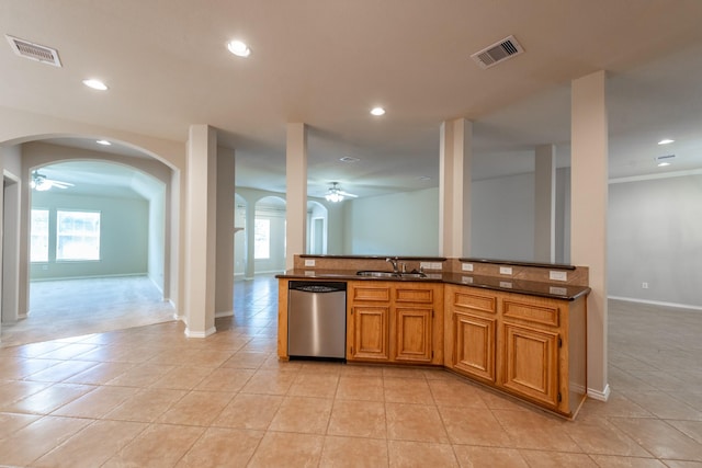 kitchen featuring dishwasher, ornamental molding, sink, and light tile patterned floors