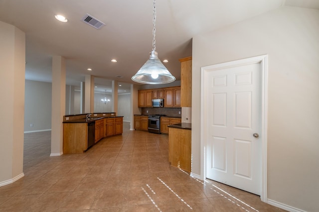 kitchen with appliances with stainless steel finishes, decorative light fixtures, tasteful backsplash, and light tile patterned flooring