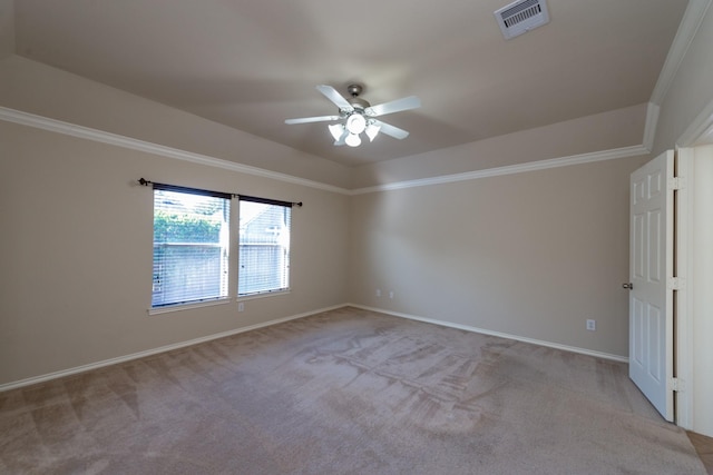 carpeted empty room featuring ceiling fan and ornamental molding