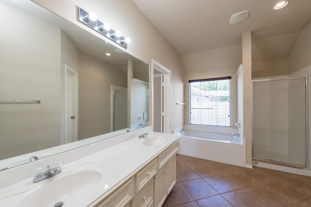 bathroom with tile patterned flooring, vanity, and separate shower and tub