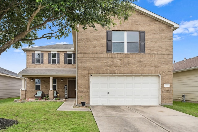 view of front of property featuring a front yard and a garage