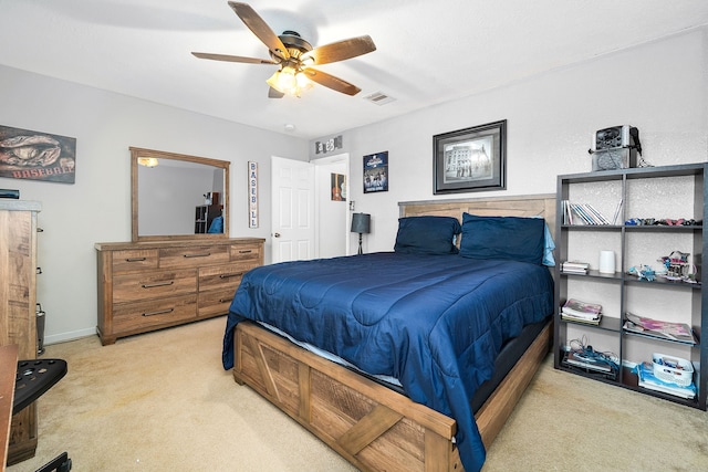 bedroom with ceiling fan and light carpet