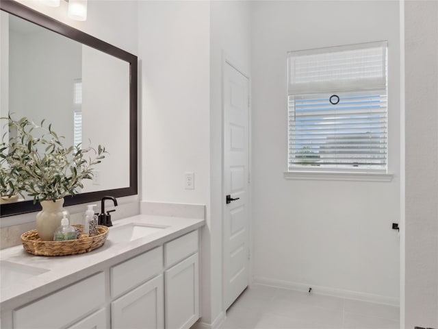 bathroom with tile patterned flooring and vanity