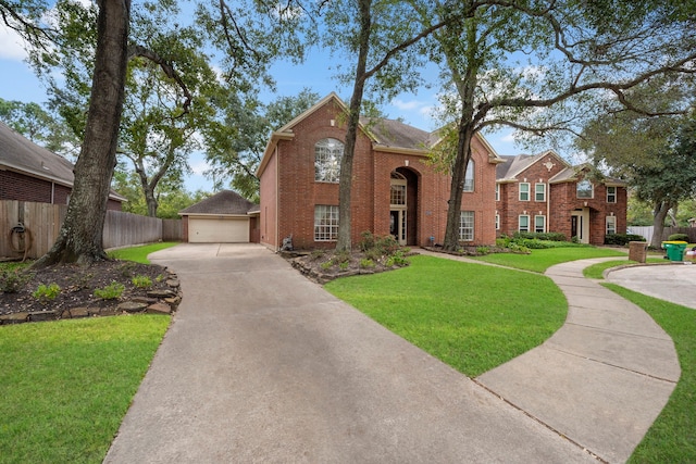 view of front of home with a garage and a front lawn