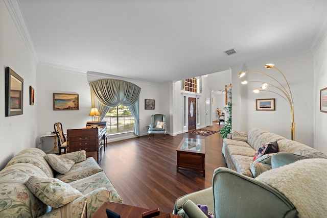 living room with dark hardwood / wood-style flooring and crown molding