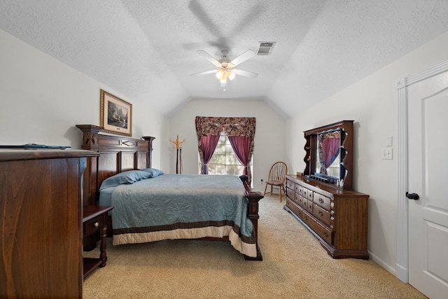 carpeted bedroom with ceiling fan, a textured ceiling, and vaulted ceiling