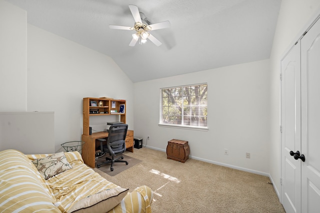 office space featuring carpet flooring, ceiling fan, and lofted ceiling