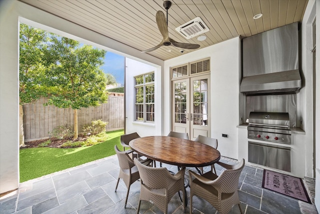 view of patio / terrace featuring ceiling fan, exterior kitchen, and grilling area