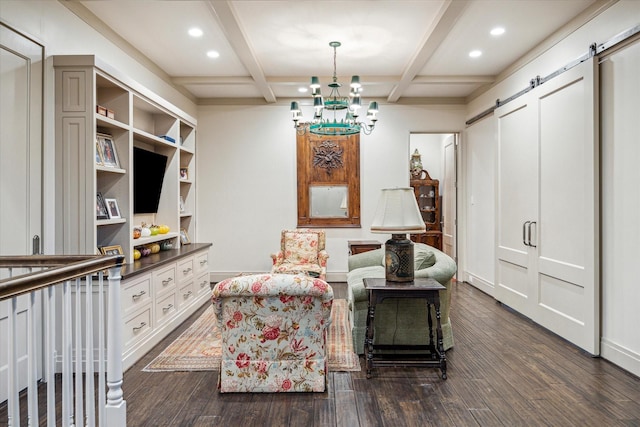 living area with beam ceiling, a barn door, and dark hardwood / wood-style flooring