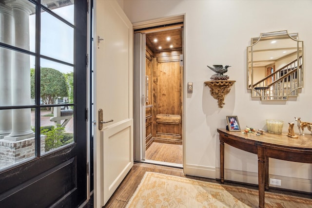 doorway with light hardwood / wood-style flooring