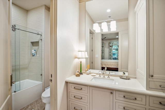 full bathroom featuring vanity, toilet, and enclosed tub / shower combo