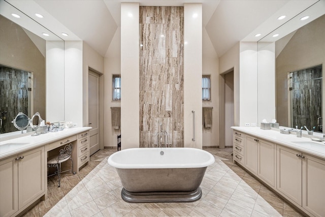 bathroom featuring vanity, a tub to relax in, and high vaulted ceiling