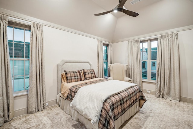 carpeted bedroom featuring multiple windows, ceiling fan, and high vaulted ceiling