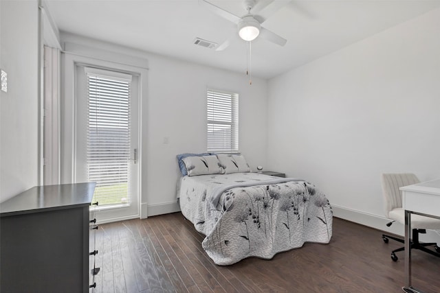 bedroom with ceiling fan and dark wood-type flooring