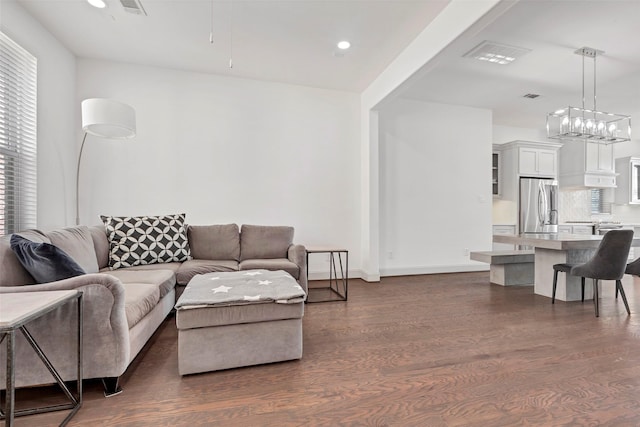 living room with dark hardwood / wood-style flooring