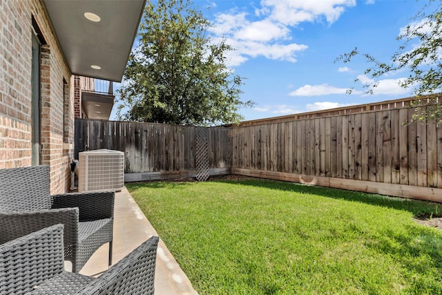 view of yard featuring central AC