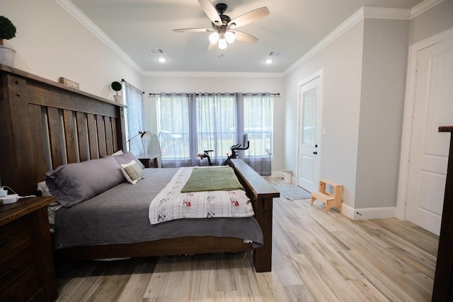 bedroom featuring ceiling fan, light hardwood / wood-style flooring, and ornamental molding