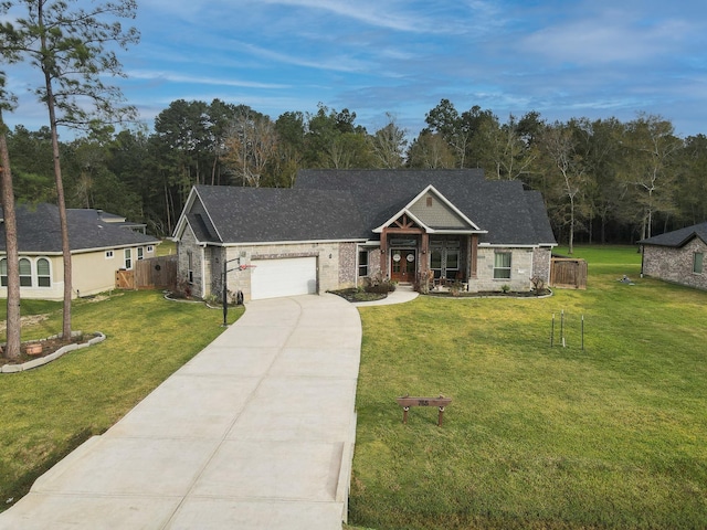 view of front facade featuring a garage and a front lawn