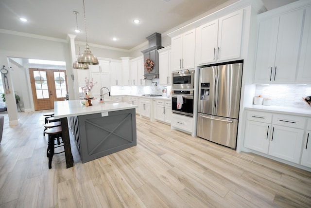 kitchen featuring appliances with stainless steel finishes, white cabinetry, and french doors