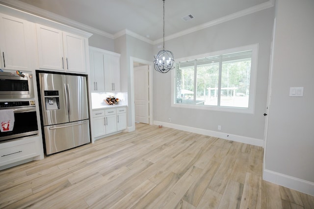 kitchen featuring white cabinetry, ornamental molding, light hardwood / wood-style floors, and appliances with stainless steel finishes