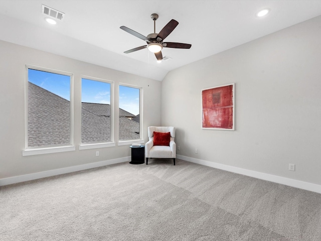 unfurnished room with ceiling fan, carpet, and lofted ceiling