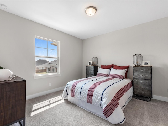 bedroom featuring light colored carpet