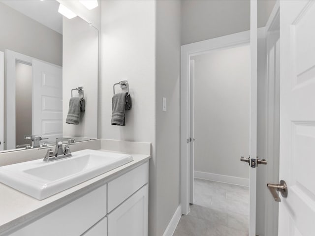 bathroom featuring tile patterned floors and vanity