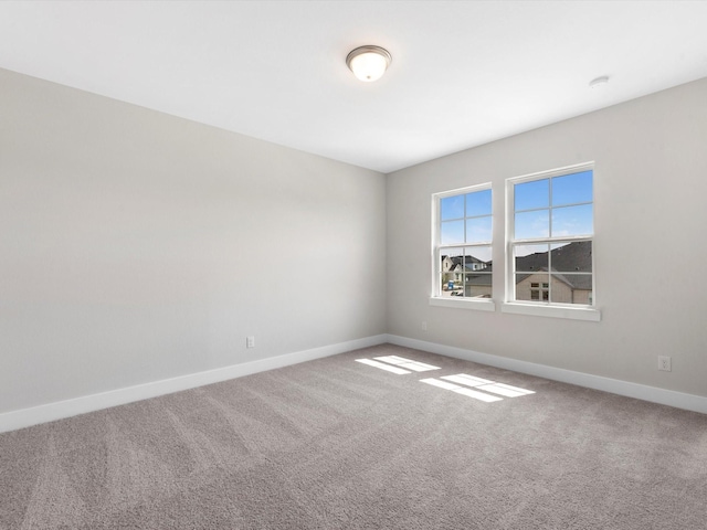 unfurnished room with carpet flooring