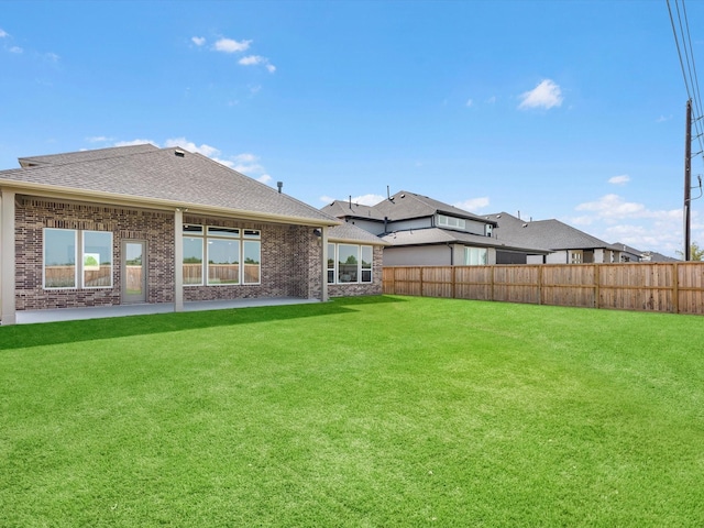 rear view of house with a lawn