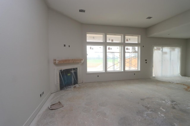 unfurnished living room featuring a fireplace