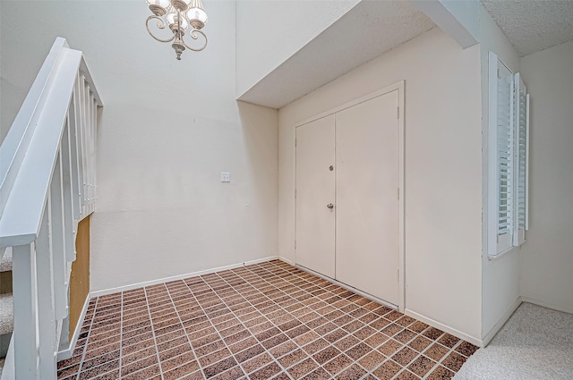 foyer with a notable chandelier