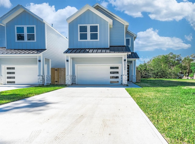 view of front of house featuring a front lawn and a garage