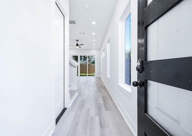 hall with light wood-type flooring