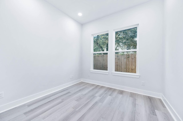 empty room with light hardwood / wood-style floors