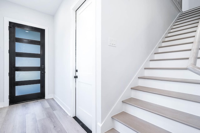 foyer entrance with light wood-type flooring