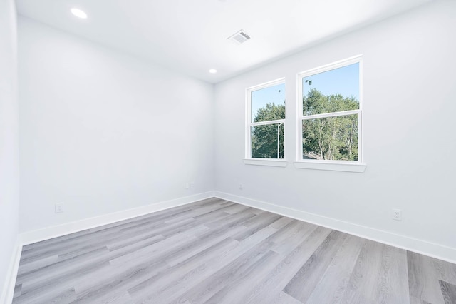 unfurnished room featuring light wood-type flooring