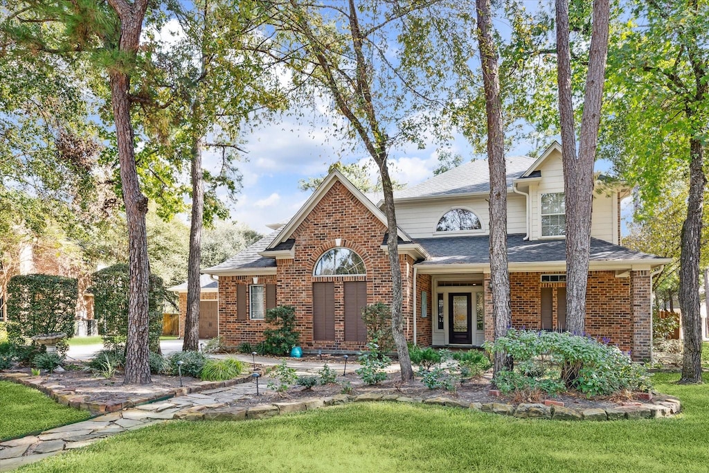 front facade with a front yard