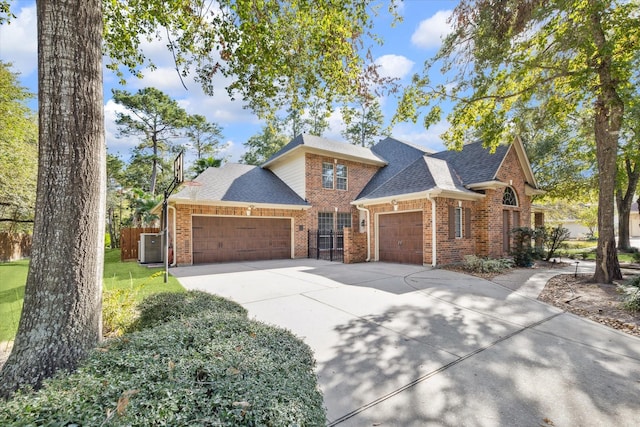 view of front of home with a garage and a front lawn