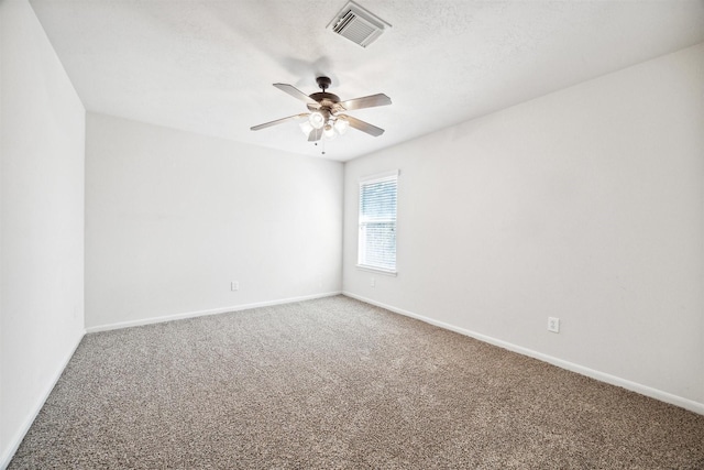 unfurnished room with carpet flooring, a textured ceiling, and ceiling fan