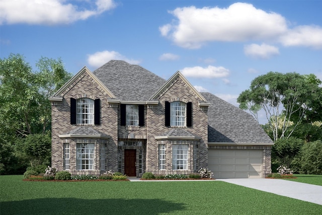 view of front of house featuring a front yard and a garage