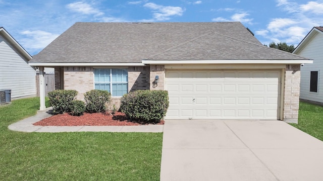 view of front of property featuring a garage and a front lawn