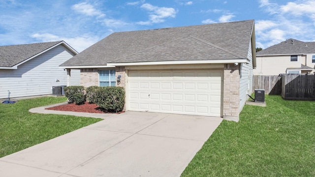 view of front of house with cooling unit, a front yard, and a garage