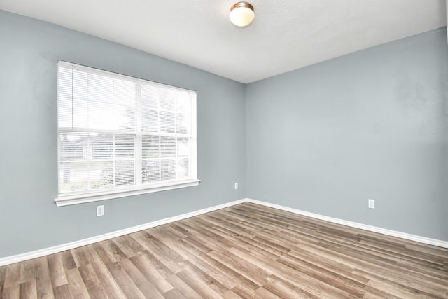 spare room featuring hardwood / wood-style floors