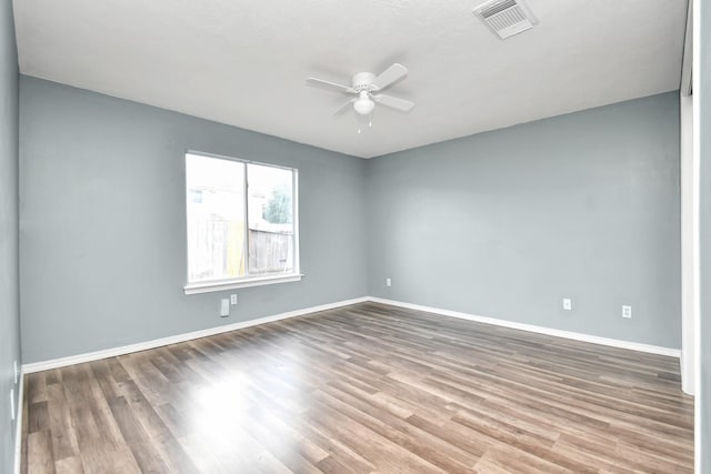 unfurnished room featuring hardwood / wood-style flooring and ceiling fan