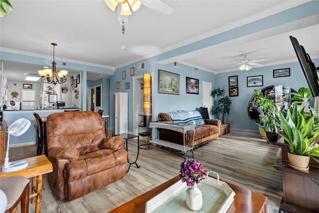 living room with wood-type flooring and ornamental molding