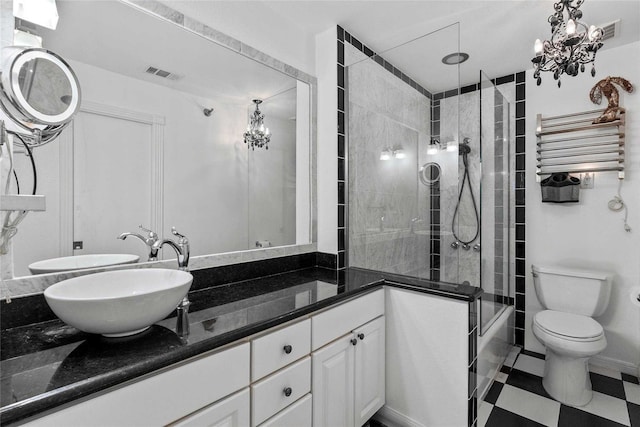 full bathroom featuring shower / bath combination with glass door, vanity, and toilet