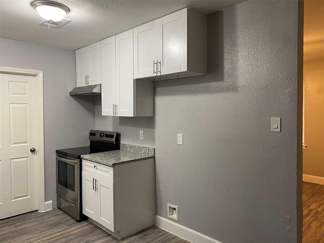 kitchen featuring electric range, dark hardwood / wood-style floors, and white cabinets